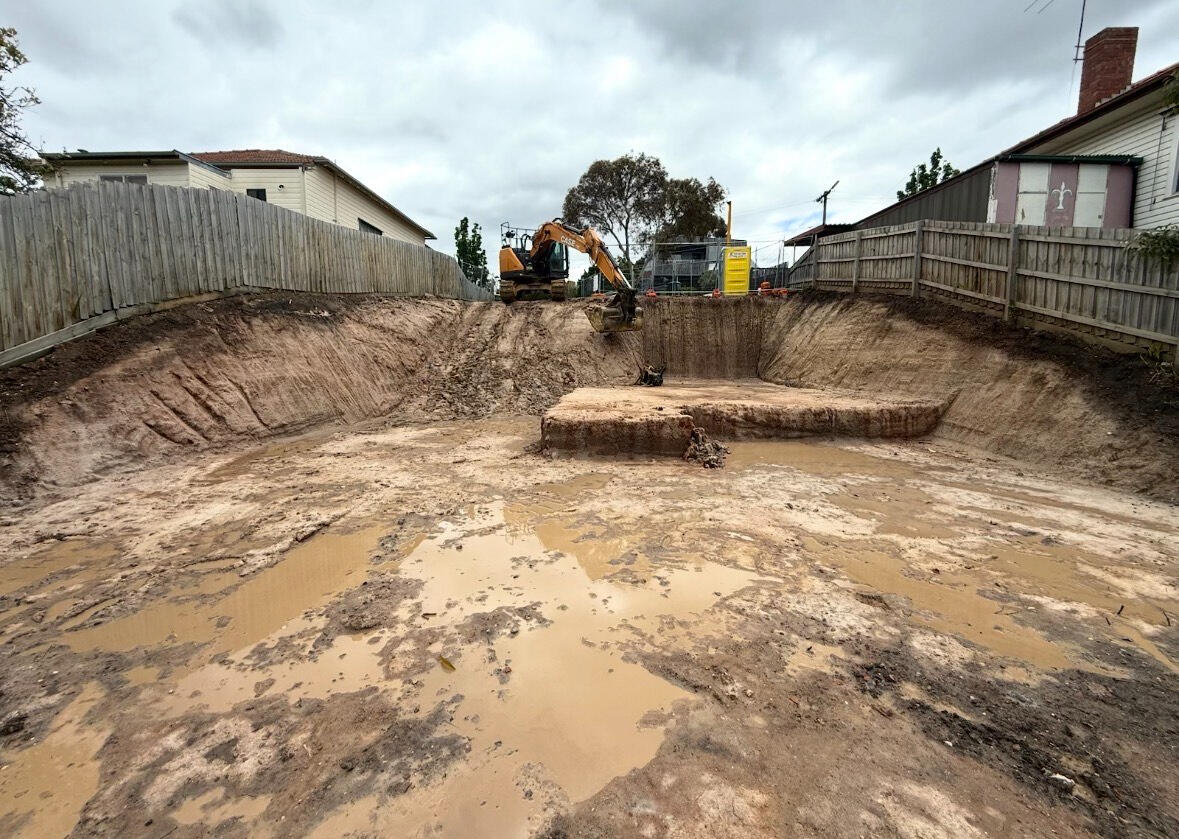 Professional site cut on a sloping residential block in Melbourne with drainage and soil removal.